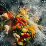 Overhead view of a vibrant stir-fry in progress, showing colorful chicken and vegetables being cooked in a wok, illustrating the core of the question: do you stir fry chicken or vegetables first?